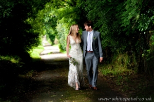 Laura and Jack stroll up the lane near the chapel at Hazelwood House